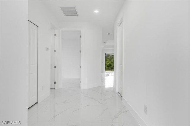 452/454 Loretta Ave S, Lehigh Acres, FL 33974 - corridor featuring baseboards, light marble finish flooring, and recessed lighting