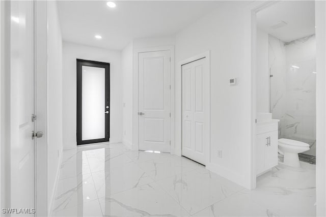 452/454 Loretta Ave S, Lehigh Acres, FL 33974 - full bath featuring baseboards, marble finish flooring, toilet, recessed lighting, and vanity