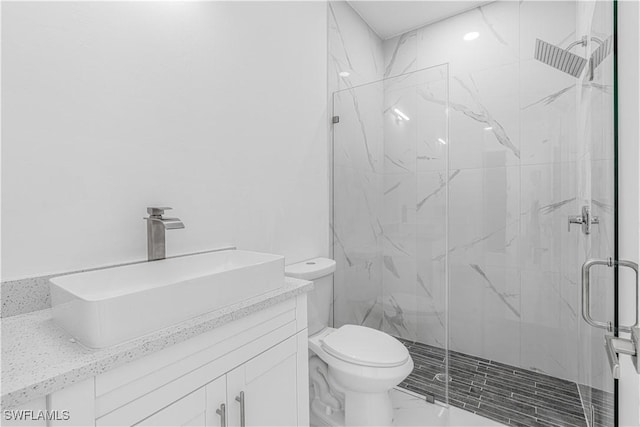 452/454 Loretta Ave S, Lehigh Acres, FL 33974 - bathroom featuring a marble finish shower, toilet, marble look tile flooring, and vanity