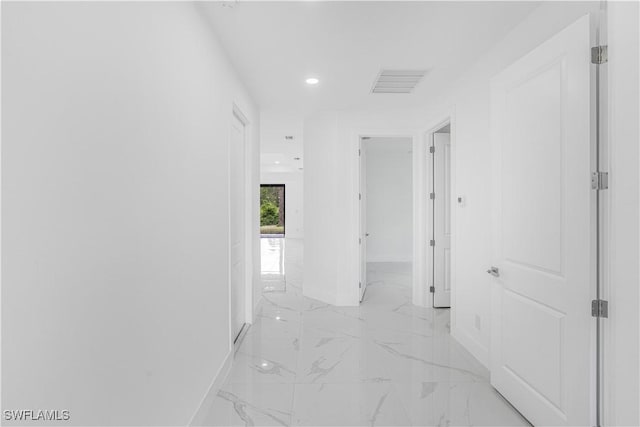 452/454 Loretta Ave S, Lehigh Acres, FL 33974 - hall featuring baseboards, light marble finish floors, and recessed lighting