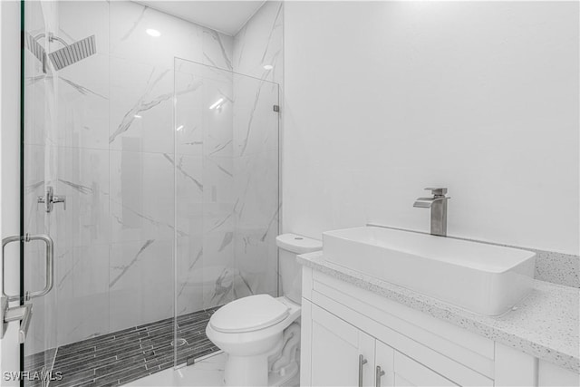 452/454 Loretta Ave S, Lehigh Acres, FL 33974 - bathroom with a marble finish shower, vanity, toilet, and marble finish flooring