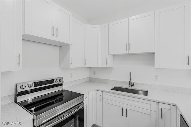 452/454 Loretta Ave S, Lehigh Acres, FL 33974 - kitchen featuring stainless steel electric stove, a sink, white cabinetry, and dishwasher