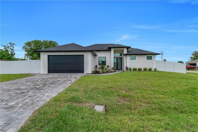 139 SE 2nd Ave, Cape Coral, FL 33990 - prairie-style house featuring a garage, decorative driveway, stucco siding, and roof with shingles