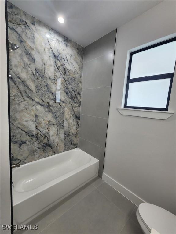 3279 31st Ave NE, Naples, FL 34120 - bathroom featuring tile patterned flooring, toilet, baseboards, bathing tub / shower combination, and recessed lighting