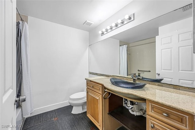 1220 Reserve Way Unit 107, Naples, FL 34105 - full bath with vanity, toilet, shower / bath combo with shower curtain, tile patterned flooring, and baseboards