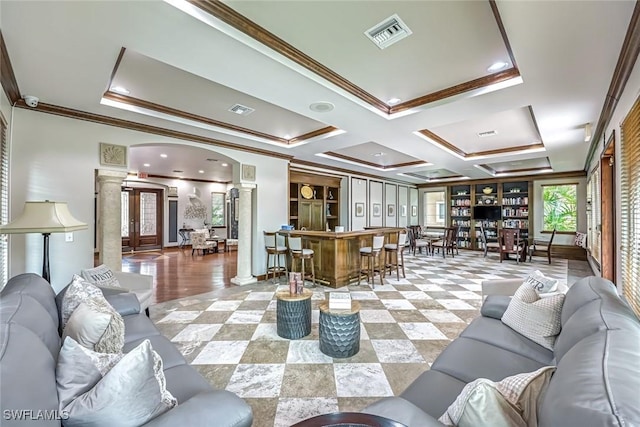 1220 Reserve Way Unit 107, Naples, FL 34105 - living room with ornamental molding, ornate columns, a community bar, and coffered ceiling