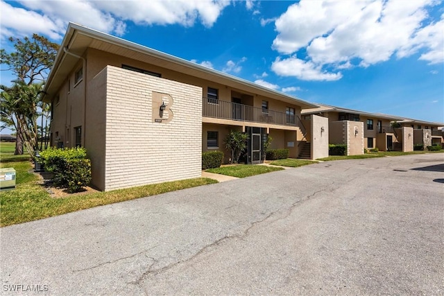 2133 SW Pine Ln Unit 1, Cape Coral, FL 33991 - view of property featuring stairs