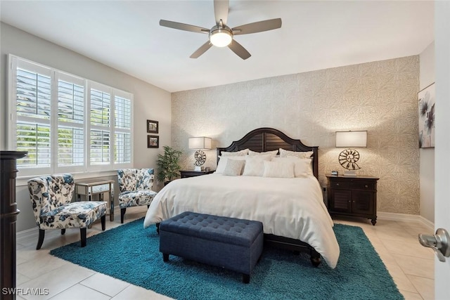 14559 Topsail Dr, Naples, FL 34114 - bedroom with wallpapered walls, light tile patterned flooring, baseboards, and a ceiling fan