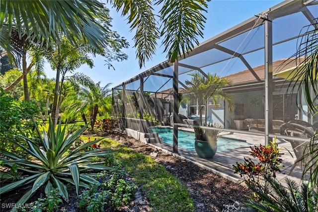 14559 Topsail Dr, Naples, FL 34114 - outdoor pool with glass enclosure and a patio area
