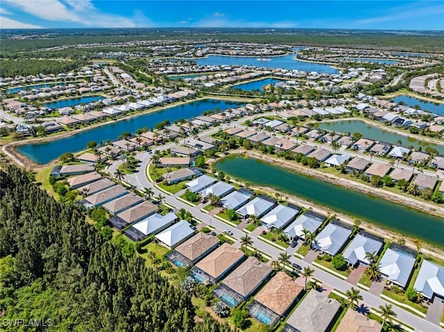 14559 Topsail Dr, Naples, FL 34114 - aerial overview of property's location with nearby suburban area and a large body of water
