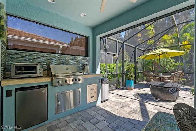 14559 Topsail Dr, Naples, FL 34114 - view of patio with glass enclosure, a ceiling fan, a sink, and outdoor dining area