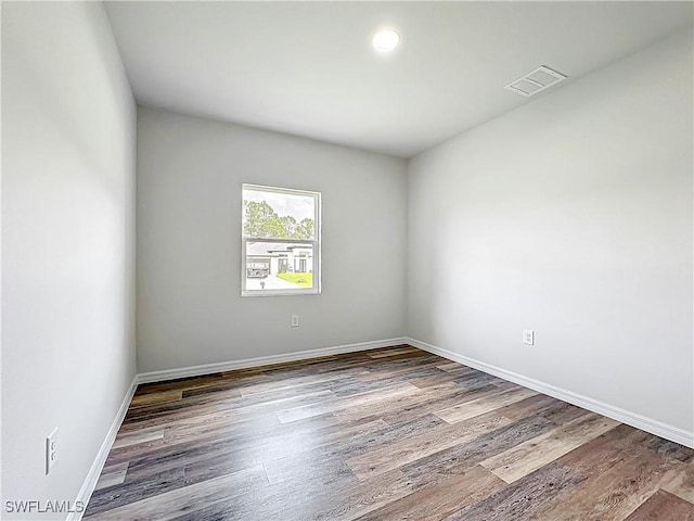 Anthony Anthony Street E 912, Lehigh Acres, FL 33974 - empty room featuring wood finished floors and baseboards