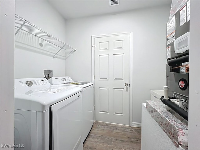 Anthony Anthony Street E 912, Lehigh Acres, FL 33974 - laundry area featuring washer and clothes dryer and wood finished floors