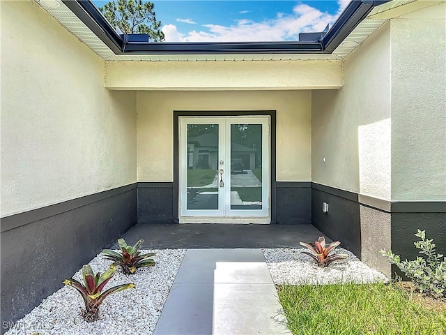 Anthony Anthony Street E 912, Lehigh Acres, FL 33974 - property entrance featuring french doors and stucco siding