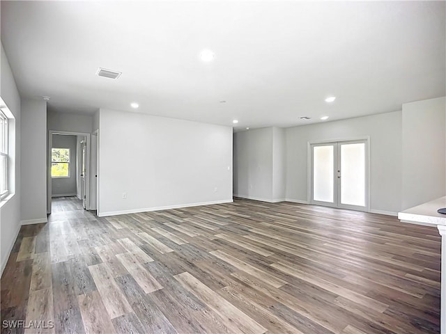 Anthony Anthony Street E 912, Lehigh Acres, FL 33974 - spare room with wood finished floors, french doors, and recessed lighting