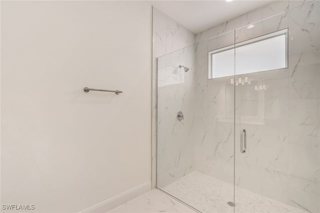 2807 19th St W, Lehigh Acres, FL 33971 - full bathroom featuring a marble finish shower, marble finish flooring, and baseboards