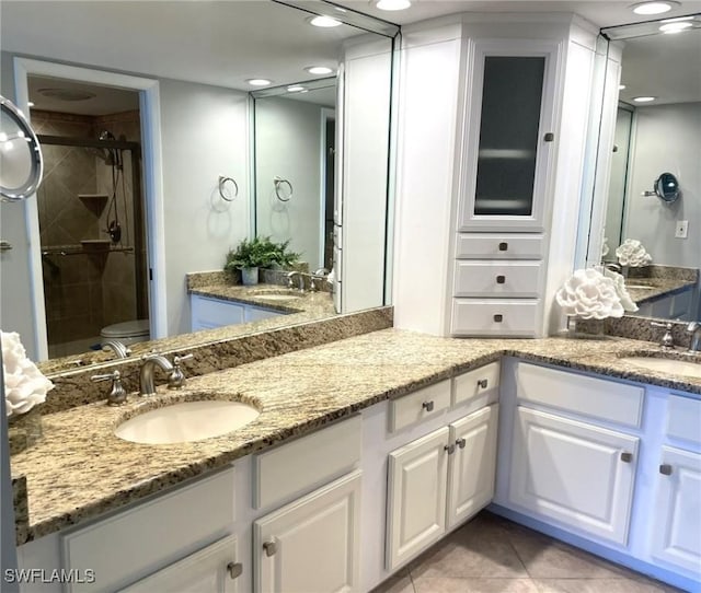 7150 Estero Blvd Unit 800, Fort Myers Beach, FL 33931 - full bath with double vanity, a stall shower, toilet, tile patterned flooring, and recessed lighting