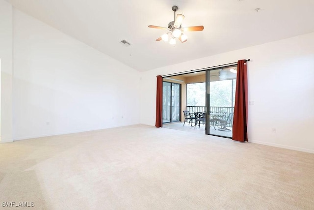 3799 Costa Maya Way Unit 202, Estero, FL 33928 - empty room with vaulted ceiling, light colored carpet, ceiling fan, baseboards, and fire sprinkler in ceiling