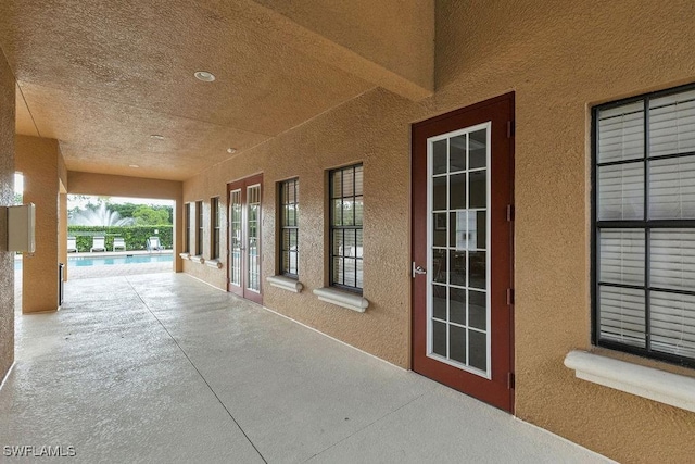 3799 Costa Maya Way Unit 202, Estero, FL 33928 - view of patio / terrace featuring a community pool