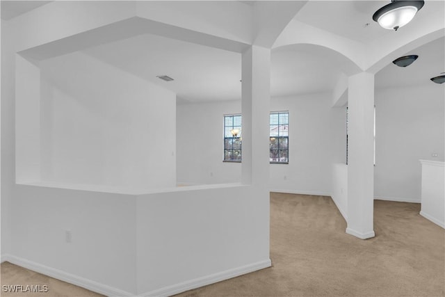 3799 Costa Maya Way Unit 202, Estero, FL 33928 - below grade area featuring carpet floors, baseboards, and arched walkways