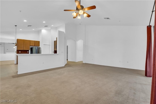 3799 Costa Maya Way Unit 202, Estero, FL 33928 - unfurnished living room with ceiling fan, light carpet, recessed lighting, arched walkways, and high vaulted ceiling
