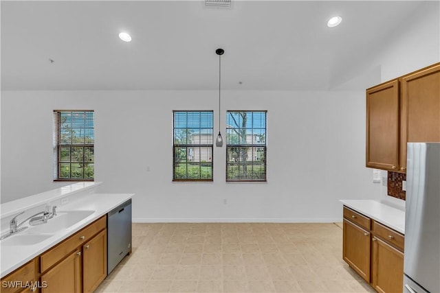 3799 Costa Maya Way Unit 202, Estero, FL 33928 - kitchen with stainless steel appliances, a sink, healthy amount of natural light, light countertops, and recessed lighting