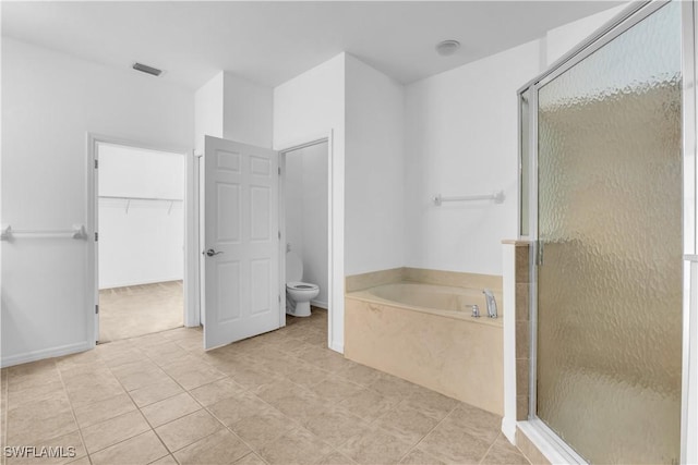 3799 Costa Maya Way Unit 202, Estero, FL 33928 - bathroom featuring a bath, a shower stall, toilet, and tile patterned flooring
