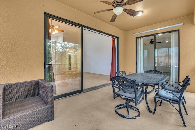 3799 Costa Maya Way Unit 202, Estero, FL 33928 - view of patio / terrace featuring a ceiling fan and outdoor dining space
