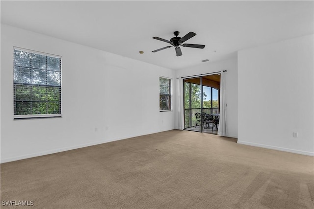 3799 Costa Maya Way Unit 202, Estero, FL 33928 - empty room with light colored carpet, a ceiling fan, and baseboards