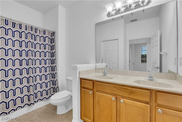 3799 Costa Maya Way Unit 202, Estero, FL 33928 - full bathroom with double vanity, toilet, a shower with shower curtain, and tile patterned floors