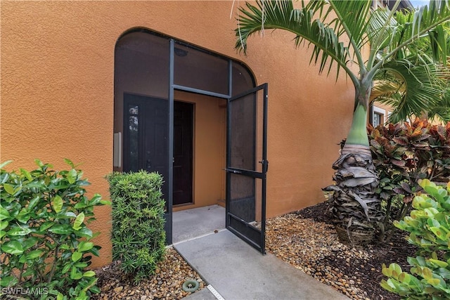 3799 Costa Maya Way Unit 202, Estero, FL 33928 - doorway to property with stucco siding