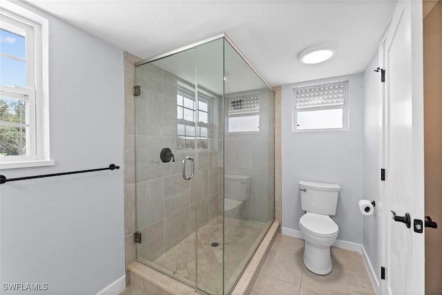3061 Shell Mound Blvd, Fort Myers Beach, FL 33931 - bathroom featuring toilet, baseboards, a stall shower, tile patterned flooring, and healthy amount of natural light