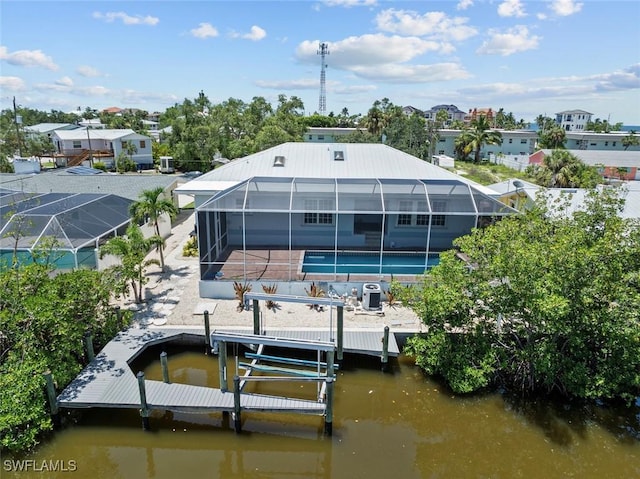 3061 Shell Mound Blvd, Fort Myers Beach, FL 33931 - rear view of property featuring an outdoor pool, a patio, a lanai, boat lift, and a water view