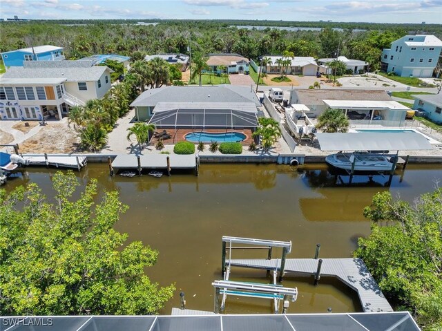 3061 Shell Mound Blvd, Fort Myers Beach, FL 33931 - aerial perspective of suburban area with a pool area and a large body of water