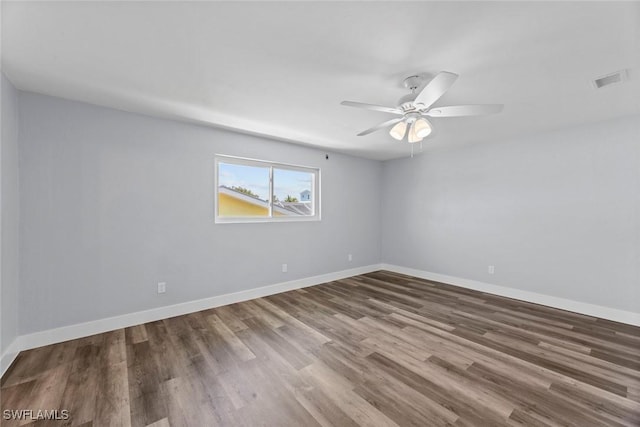 3061 Shell Mound Blvd, Fort Myers Beach, FL 33931 - spare room with wood finished floors, a ceiling fan, and baseboards