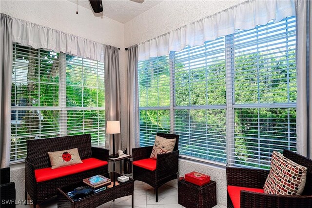 133 Colonade Cir, Naples, FL 34103 - sunroom / solarium featuring a textured wall and plenty of natural light