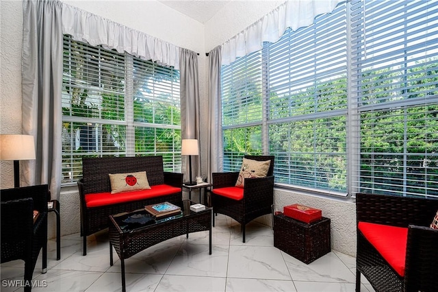 133 Colonade Cir, Naples, FL 34103 - sunroom / solarium with marble look tile flooring and a textured wall