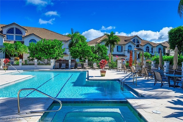 133 Colonade Cir, Naples, FL 34103 - community pool featuring a patio
