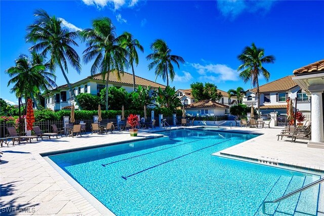 133 Colonade Cir, Naples, FL 34103 - community pool featuring a patio