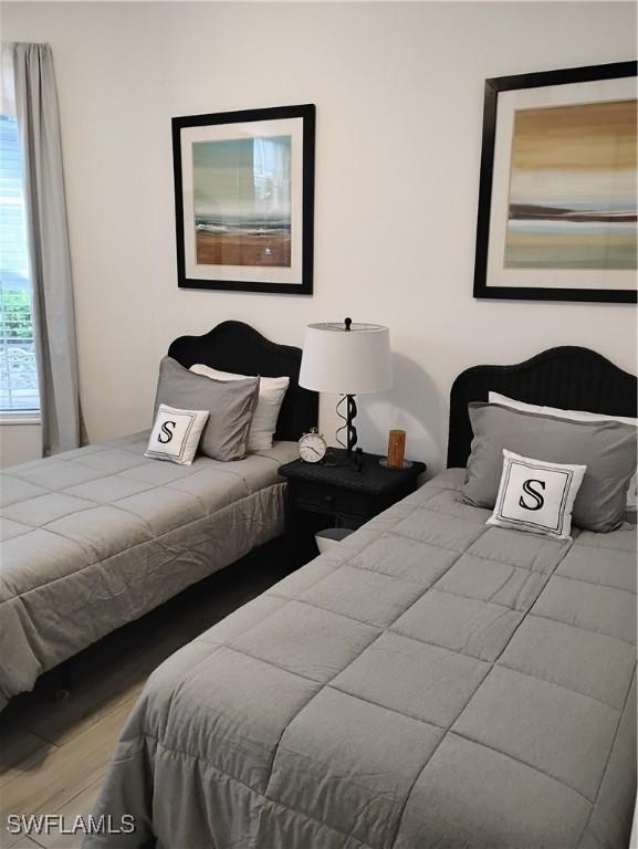 133 Colonade Cir, Naples, FL 34103 - bedroom with wood finished floors
