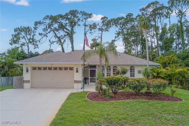 18370 Tulip Rd, Fort Myers, FL 33967 - ranch-style house with stucco siding, a garage, and concrete driveway