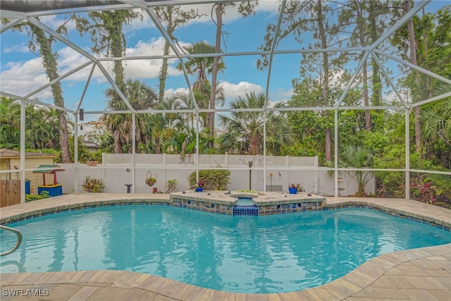 18370 Tulip Rd, Fort Myers, FL 33967 - view of swimming pool with glass enclosure and a patio