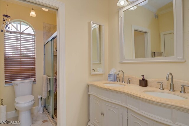 18370 Tulip Rd, Fort Myers, FL 33967 - full bathroom with toilet, double vanity, tile patterned flooring, and crown molding