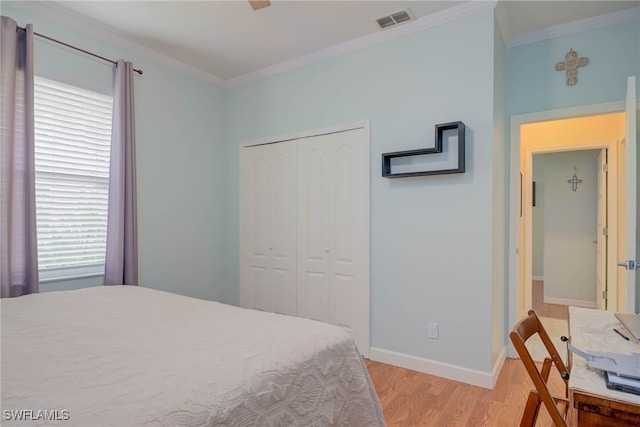 18370 Tulip Rd, Fort Myers, FL 33967 - bedroom featuring light wood finished floors, a closet, crown molding, and baseboards