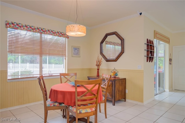 18370 Tulip Rd, Fort Myers, FL 33967 - dining space featuring wainscoting, healthy amount of natural light, crown molding, light tile patterned floors, and baseboards