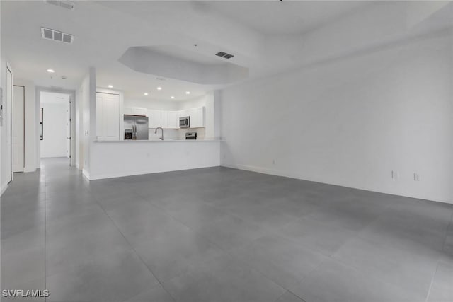 1803 Samantha Gayle Way Unit 208, Cape Coral, FL 33914 - unfurnished living room with recessed lighting, a sink, and baseboards