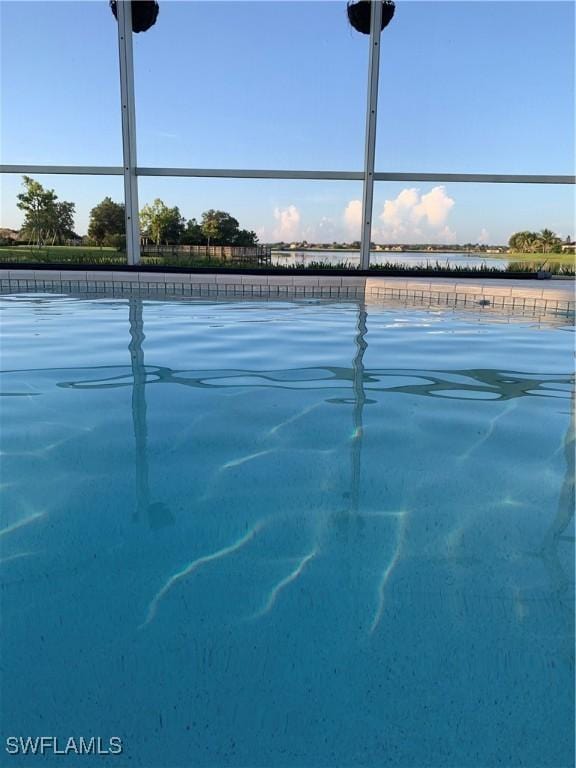 1118 Grove Dr, Naples, FL 34120 - view of tennis court with a water view