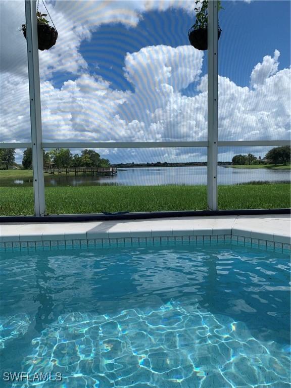 1118 Grove Dr, Naples, FL 34120 - swimming pool with a water view