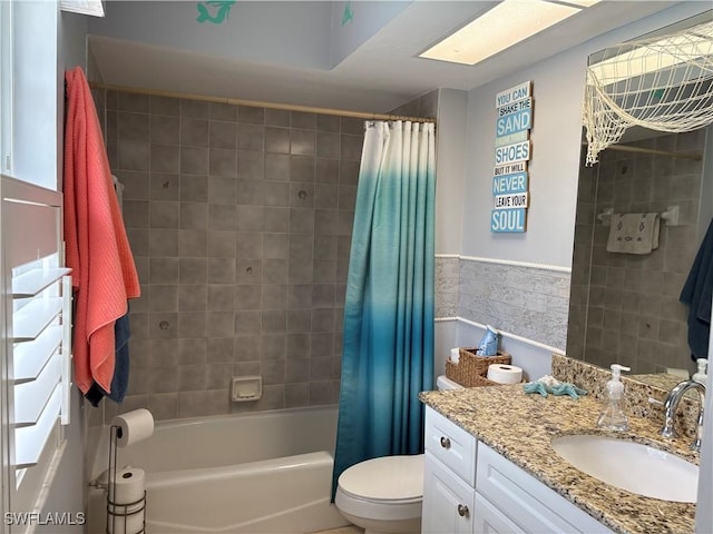 1118 Grove Dr, Naples, FL 34120 - full bathroom with vanity, shower / bathtub combination with curtain, tile walls, and a wainscoted wall