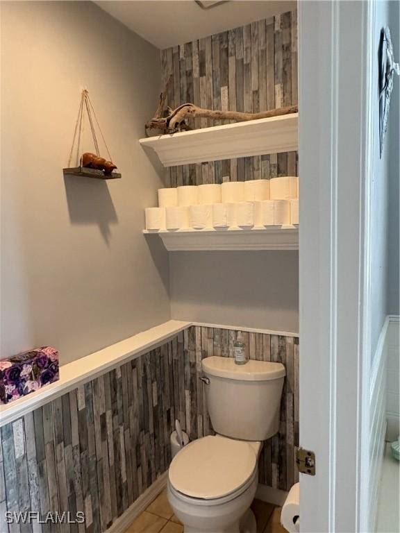 1118 Grove Dr, Naples, FL 34120 - bathroom with a wainscoted wall, tile patterned floors, and wooden walls